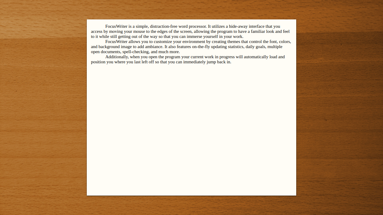FocusWriter screen showing text on paper against a wood background.