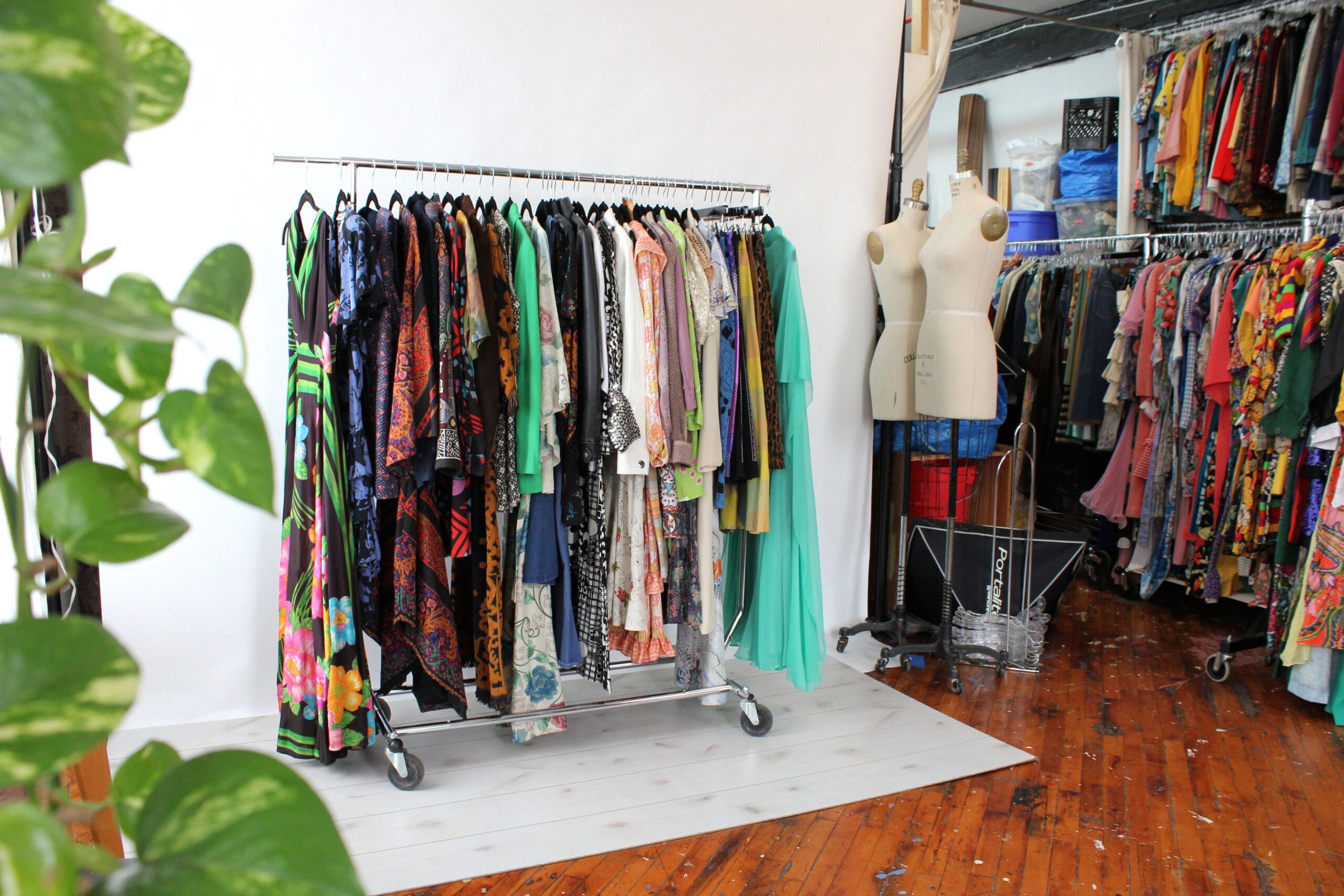 A clothing rack filled with vintage clothing in a boutique