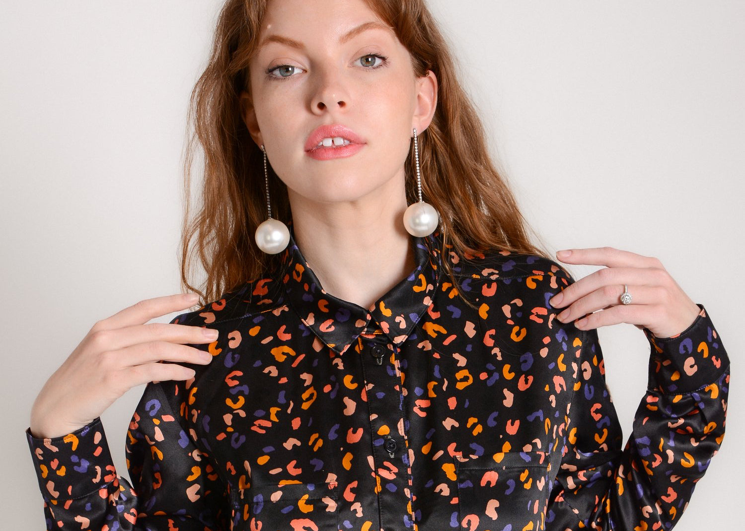 A woman models a patterned dress shirt