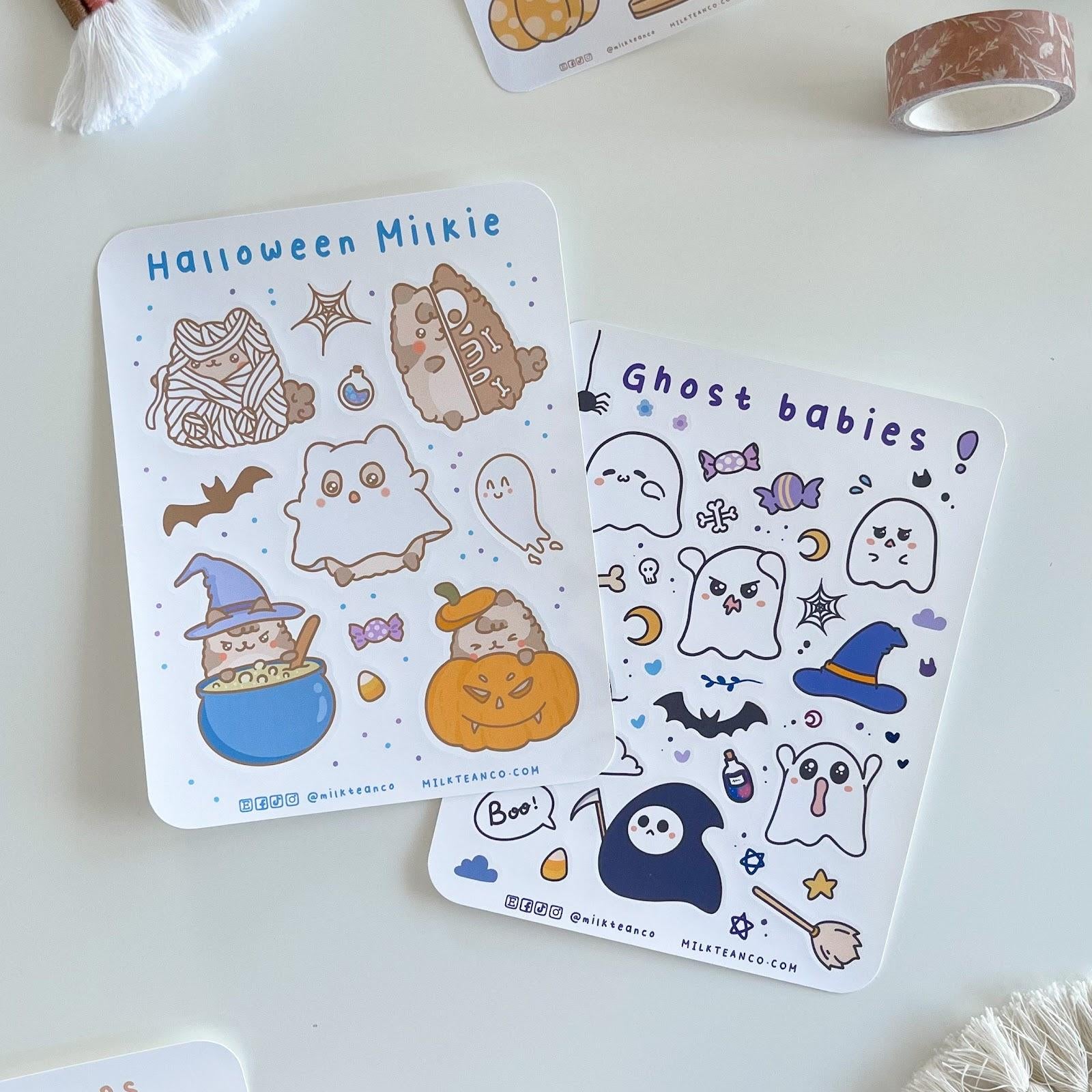 a selection of Halloween-themed cartoon cat stickers.