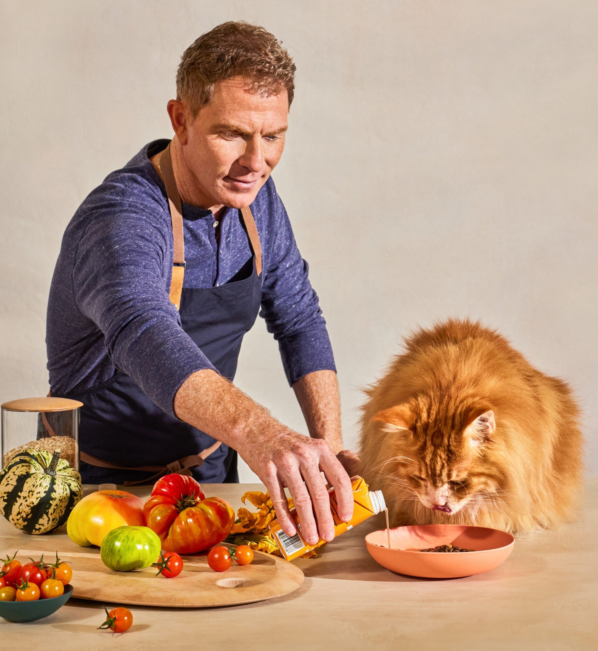 bobby flay feeds his cat nacho made by nacho food.