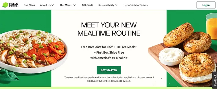 HelloFresh homepage featuring a promotion for free breakfast for life, 10 free meals, first box free, and a picture of prepared meals including a bowl and bagels.