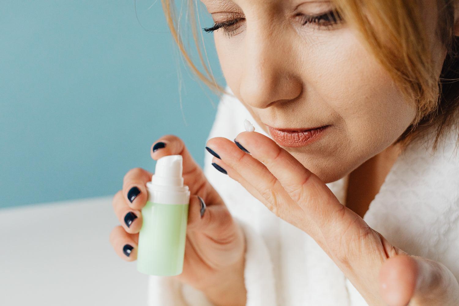 A woman smells a skincare product, a candidate for white label products