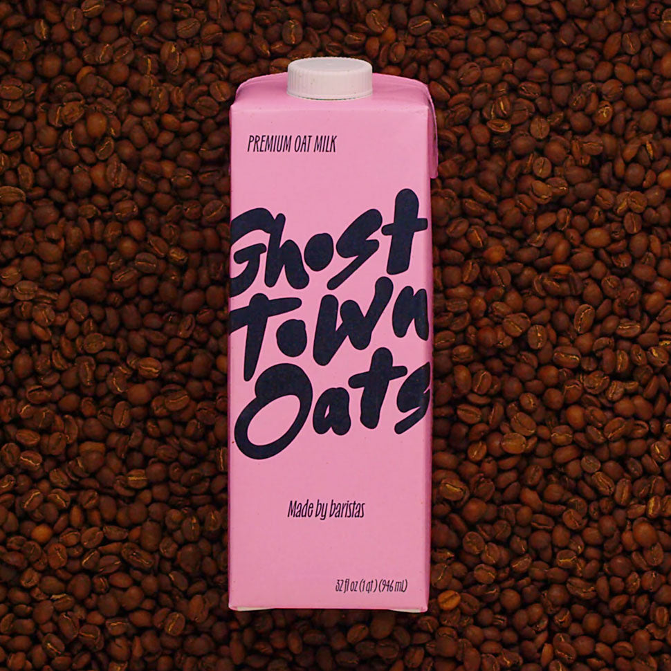 ghost town oats carton sitting in a bed of coffee beans