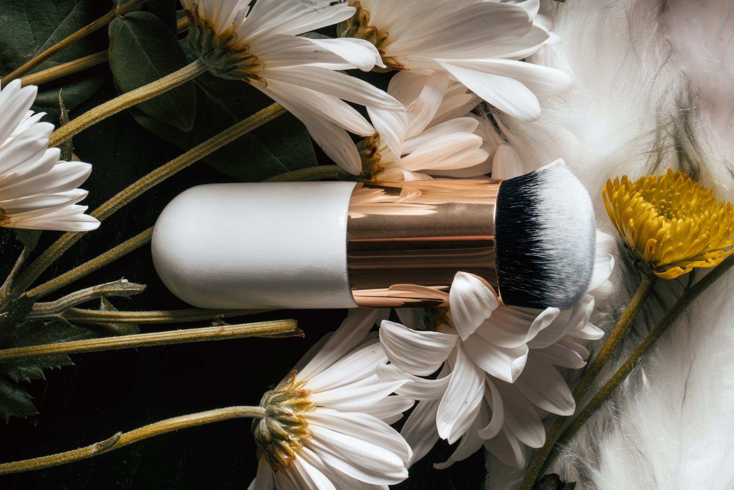 A makeup brush arranged in a bunch of flowers