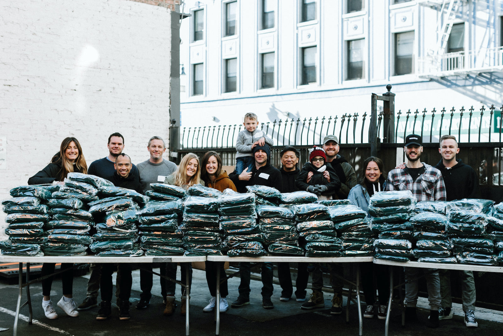 Group behind a table full of blankets