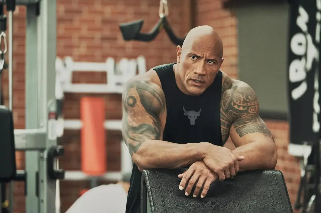 Dwayne “The Rock” Johnson taking a break at the gym.