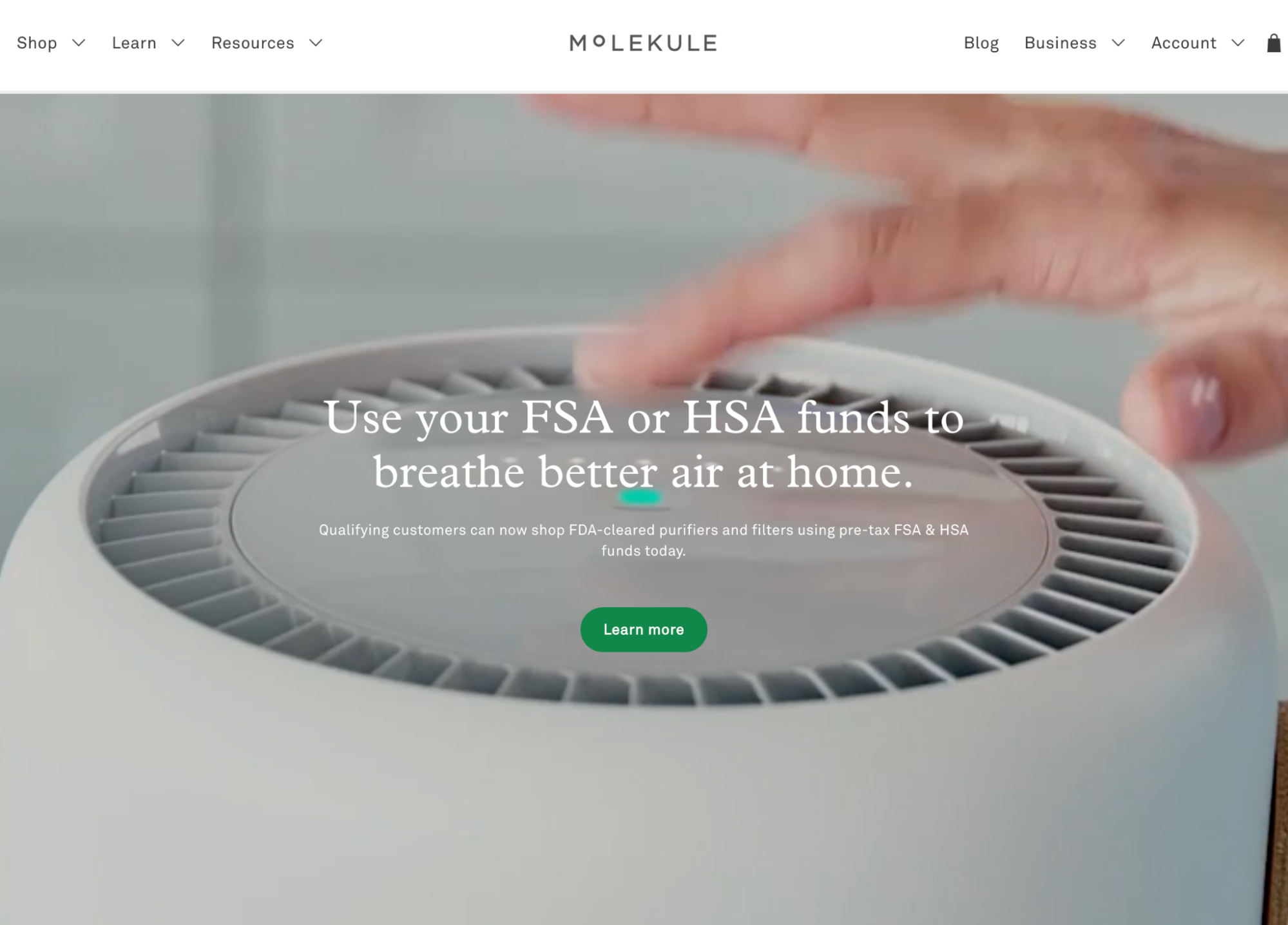 Molekule air purifier with a hand above, promoting FSA/HSA funds usage for purchase.