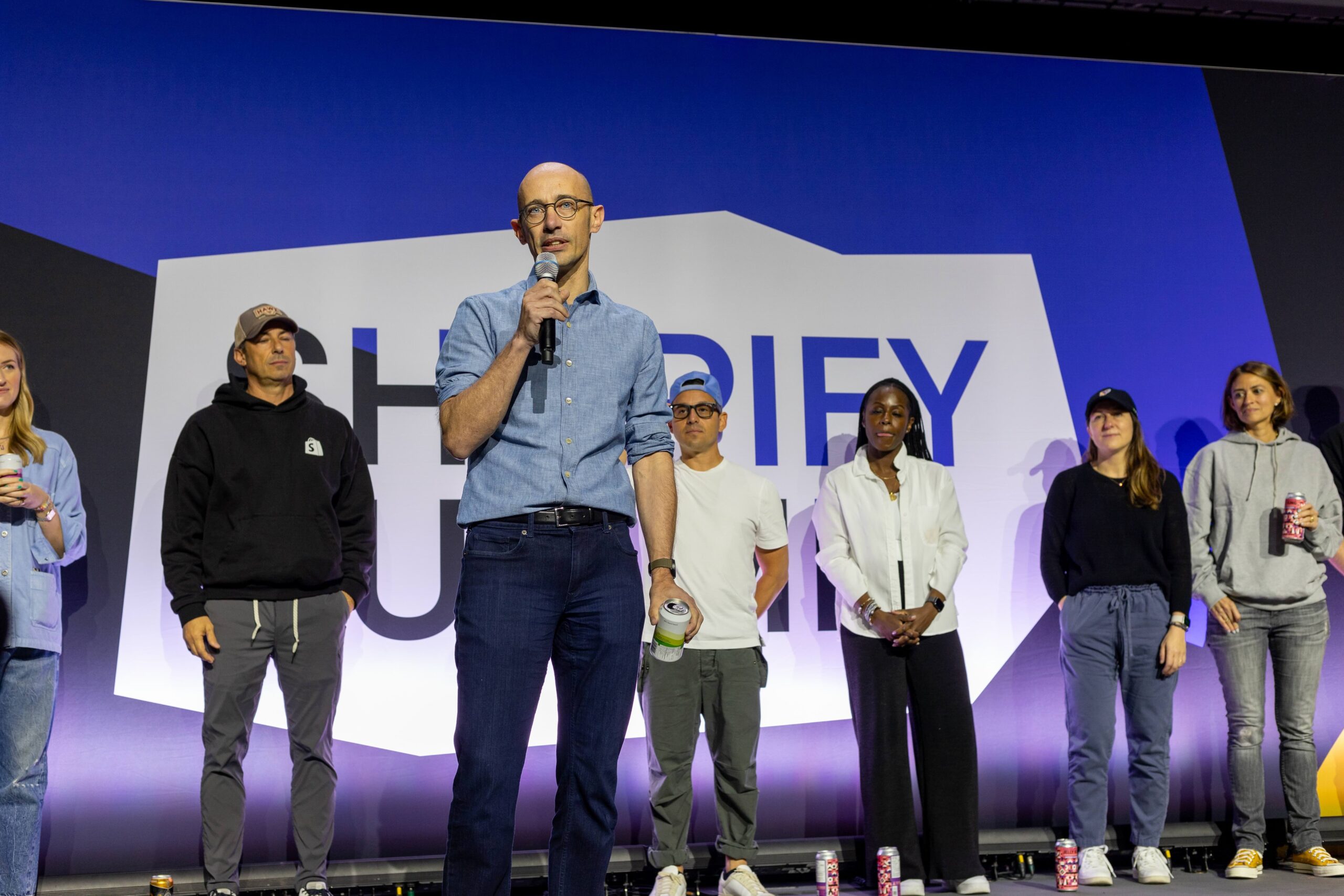 Tobi addressing employees on stage in the summer of 2024.