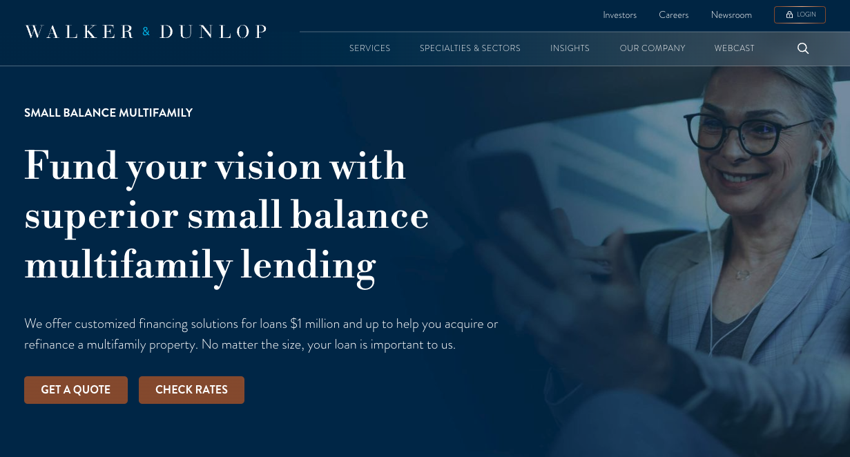 Walker & Dunlop website banner promoting small balance multifamily lending, featuring a smiling professional woman using a smartphone.