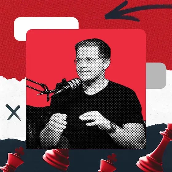 Ryan Atkinson, a man with glasses in front of a microphone