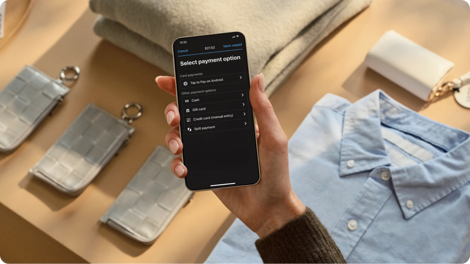 Android smartphone with the Shopify POS app showing “Tap to Pay on Android”