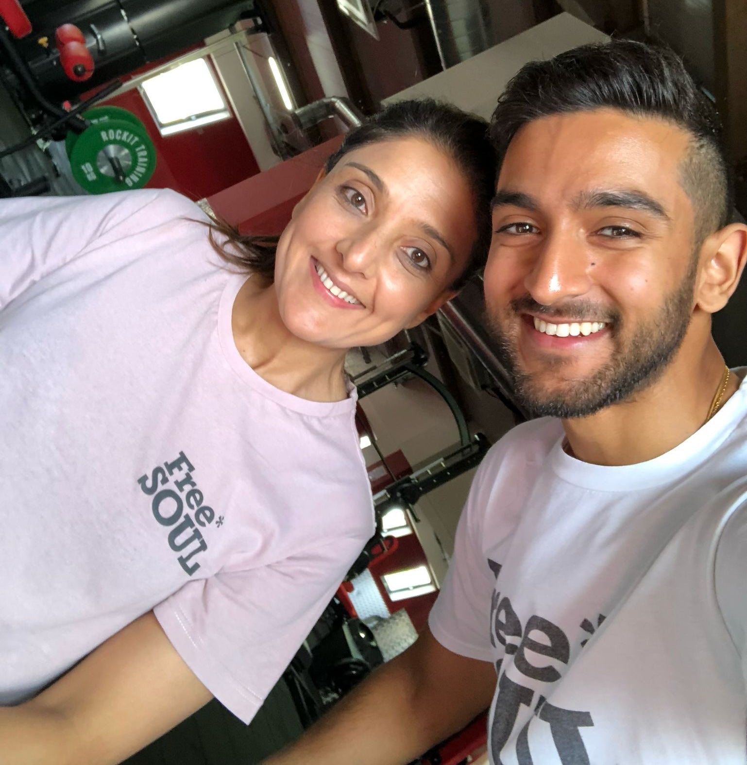 Arjun (right) and his mother (left) pose smiling for a selfie photo.