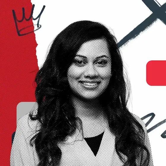 Deesha Laxsav, a smiling woman with long dark hair